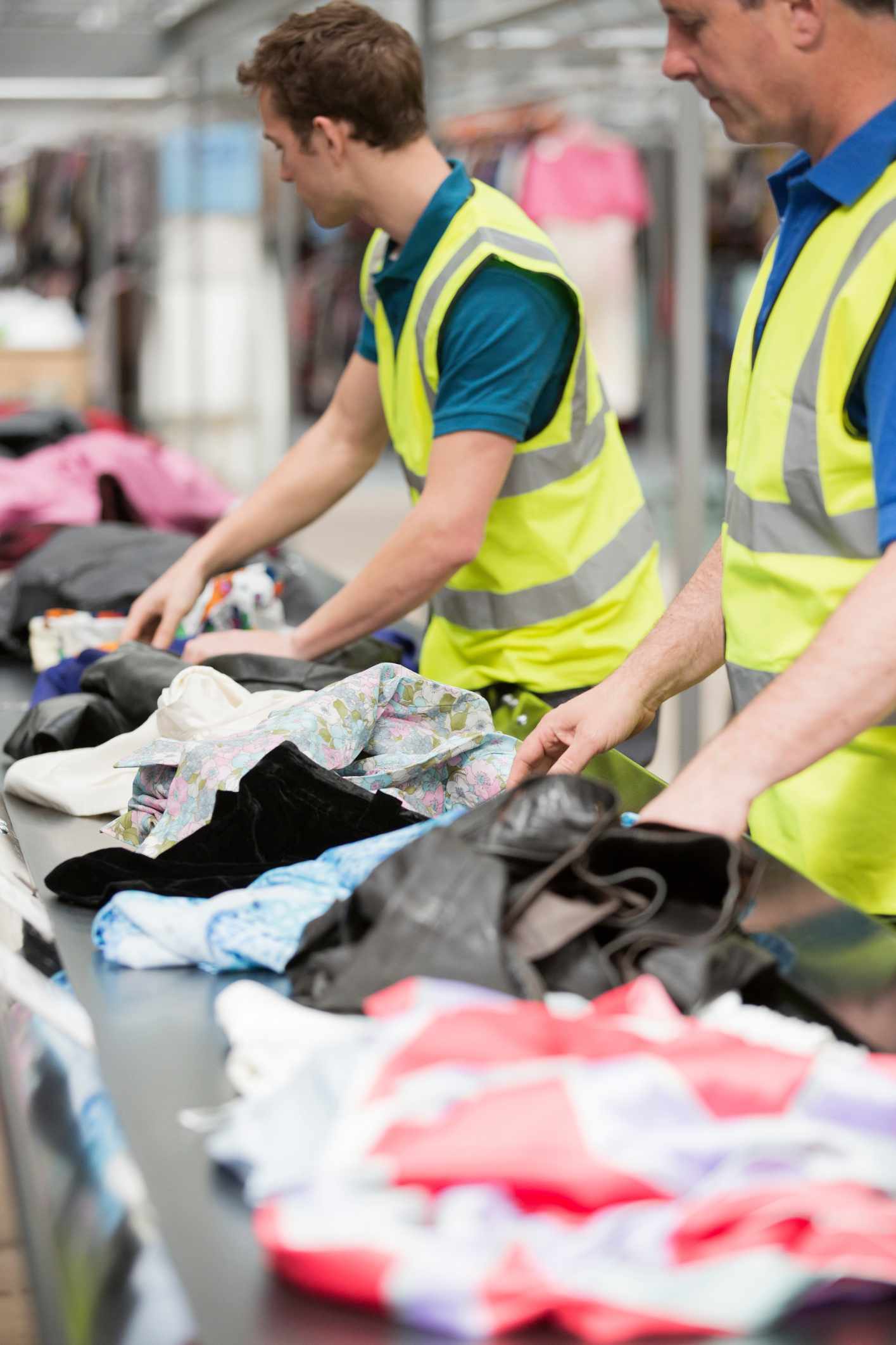 Men working at a clothing recycling business